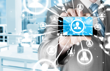 Business Hand holding a phone show the social network