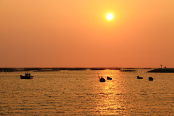 thai fishing boat in sunset