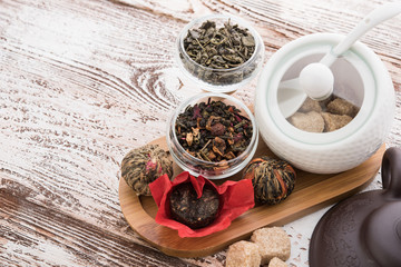 Tea cups with teapot on old wooden table