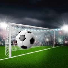 soccer ball flies into the goal