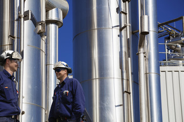 oil and gas workers with large gas-pipes, pipelines