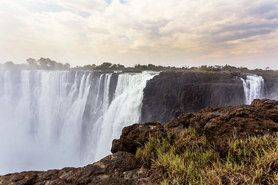 The Victoria falls with mist from water © ArtushFoto