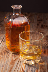Bottle of whiskey and a glass