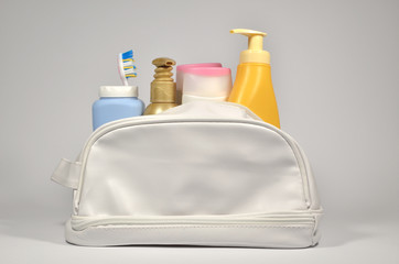 Different containers in cosmetic bag