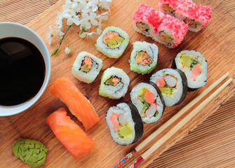 Sushi mix with soy sauce and wooden chopsticks