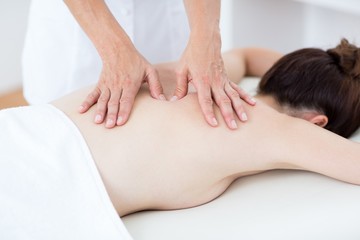 Fototapeta na wymiar Physiotherapist doing back massage