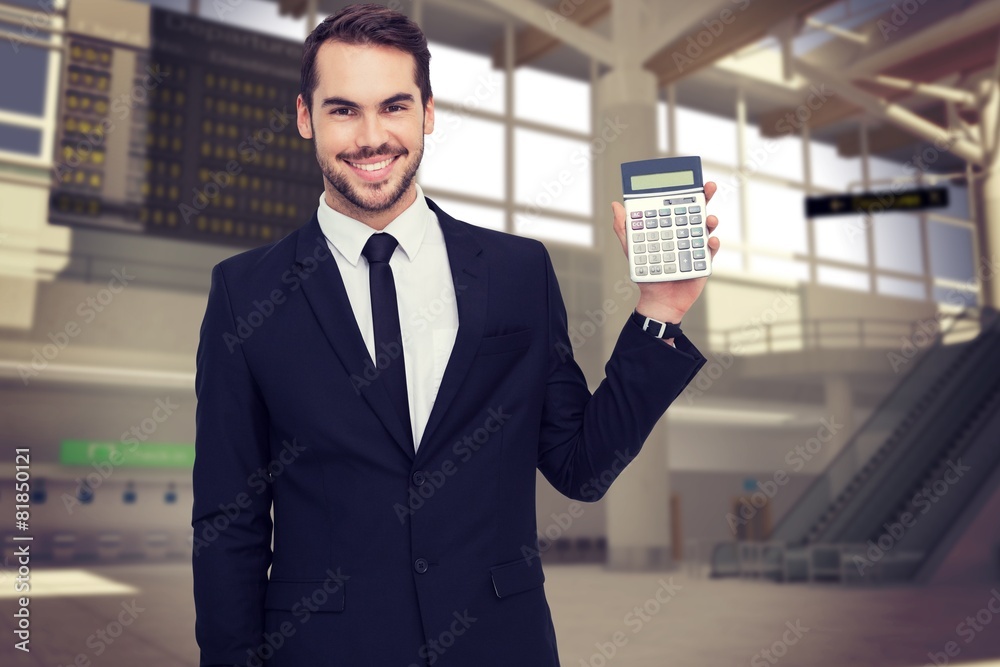 Poster Composite image of smiling businessman presenting a calculator