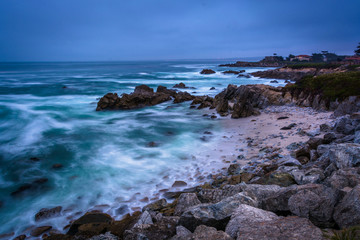 Fototapeta na wymiar Long exposure of rocks and waves in the Pacific Ocean at twiligh