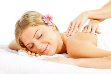 Obraz na płótnie Canvas Young woman having massage on spa treatment