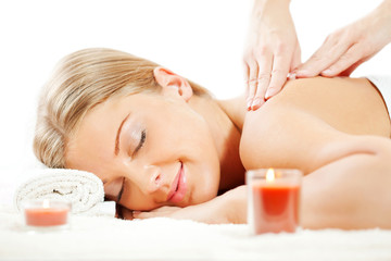 Fototapeta na wymiar Young woman having neck massage on spa treatment