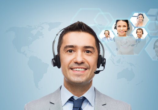smiling businessman in headset