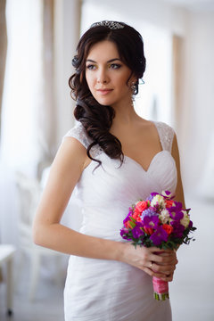 Portrait of the bride with a bouquet of flowers