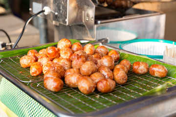 fried meatballs sale at street market
