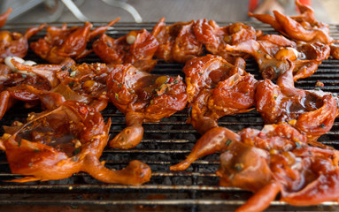 Grilled small asian birds in spicy marinade