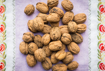 Organic walnuts on vintage kitchen cloth, clean eating concept