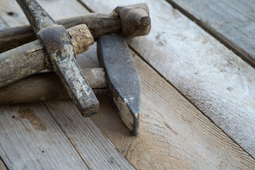Wooden background with a hammer, home improvement concept