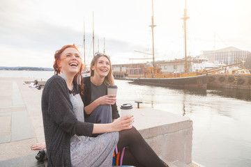 Two beautiful nordic girls enjoying life at Oslo harbour