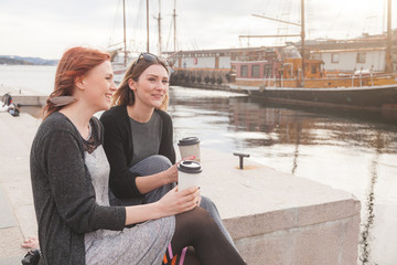 Two beautiful nordic girls enjoying life at Oslo harbour