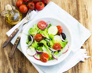 Vegetables Salad Dish with Fresh Organic Lettuce,Tomatoes,Olives