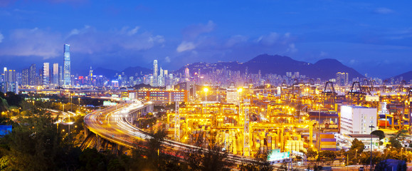Fototapeta na wymiar Panorama of cargo terminal and Hong Kong cityscape