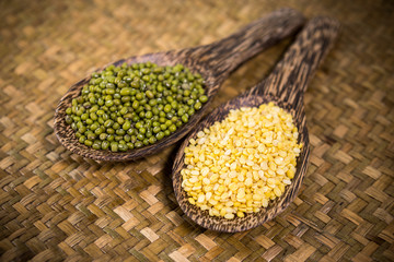 hulled split mung bean in wooden spoon 