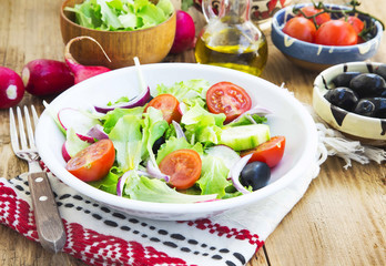 Vegetables Salad Dish with Fresh Organic Lettuce,Tomatoes,Olives