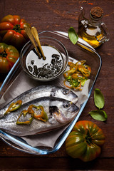 raw sea bream with homemade italian pesto ready to be put in the