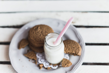 Rustic home made cookies on the wooden background with milk