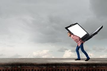Guy carrying laptop