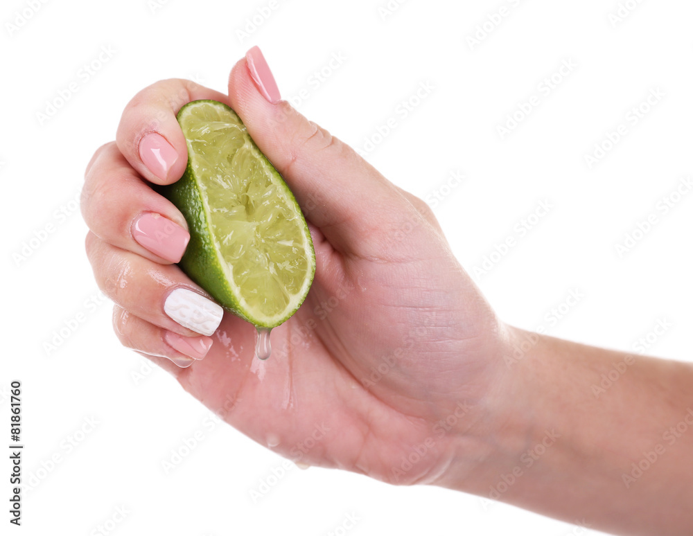 Canvas Prints female hand squeezing lime isolated on white