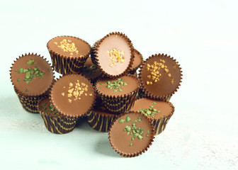 Tasty chocolate candies on wooden table
