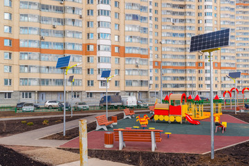 children's playground  of an apartment house with solar panels