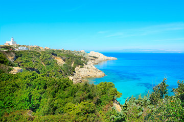 Fototapeta na wymiar Capo Testa coastline on a clear summer day