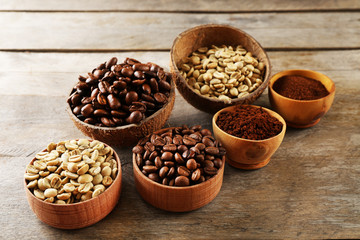 Fototapeta premium Various of coffee in small dishes on wooden background