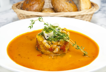 Mexican soup with chili pepper on the table in a restaurant