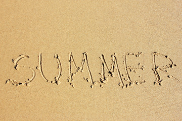 Word summer on sand of the beach
