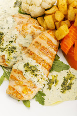 Close up of delicious chicken breast in white sauce