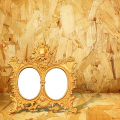 Gold  frame on wood background