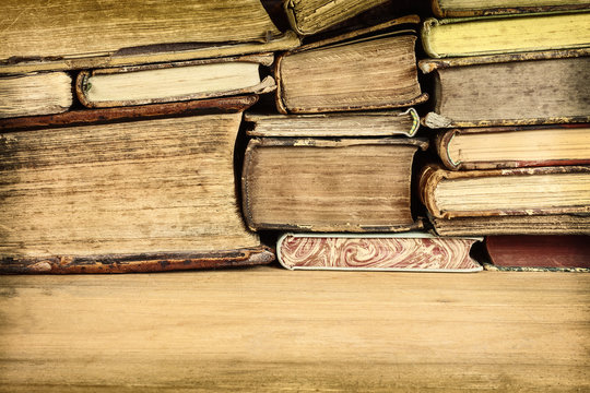 Sepia toned image of old books on a table