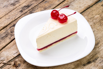 Close up image of cheesecake with cherry