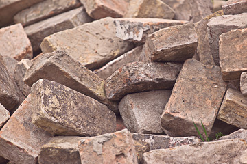 Pile of Old Used Bricks as Construction Material