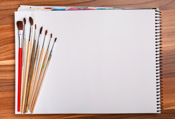 paint and sketch book with brushes