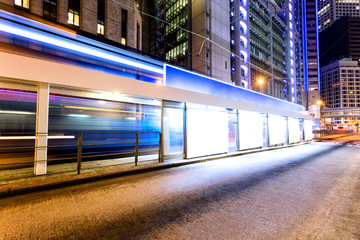 traffic light trails nearby bus stop