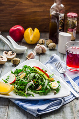 light green salad with arugula, mushrooms, quail eggs and apples