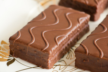 Sponge cake with chocolate on the plate