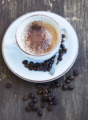 Cappuccino Cup of Coffee with Coffee Beans