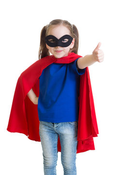 Child shows thumb up pretending to be a superhero