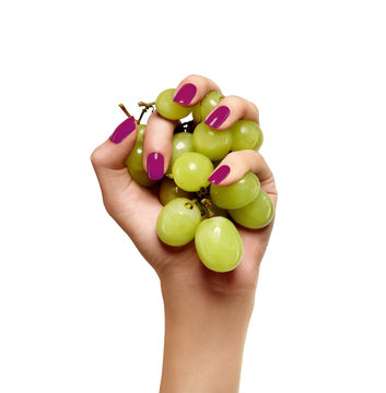 Beauty Female Hand With Green Grapes  On A White Background