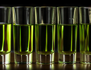 Green cocktails with absinthe isolated on a black background
