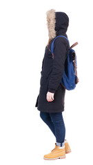 Back view woman in winter jacket with  backpack © ghoststone